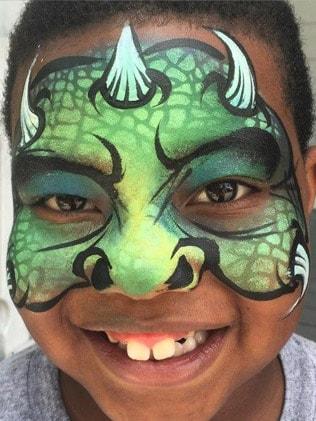 monster face paint design on young boy